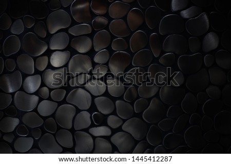 Abstract black and white background metallic pebble texture on wall for industry. Metal sheet with dark tone. Royalty-Free Stock Photo #1445412287