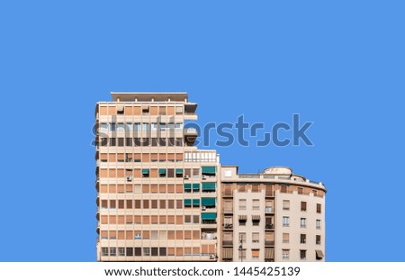 Typical facade of a building of the years sixties seventies against blue sky