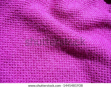 The texture of the fabric. Wool knit purple.