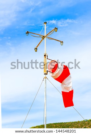 wind indicator beside the port of island Poros in Greece