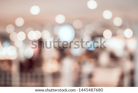 Abstract blurred image lighting bokeh shopping mall interior of department store for background and backdrop.