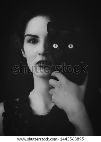 Togetherness.Close up portrait of young girl and cat.Beautiful young girl with her cat black and white portrait