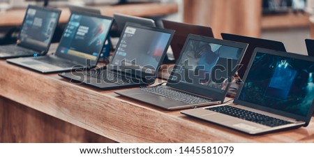 Hall shopping center. Shop digital equipment and electronics. Sale of laptops. Royalty-Free Stock Photo #1445581079