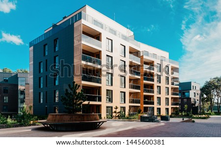 EU Pine tree at architectural complex of residential buildings. And outdoor facilities. Royalty-Free Stock Photo #1445600381