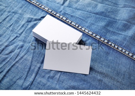 Blank business cards template on denim background. Template for graphic designers portfolios.