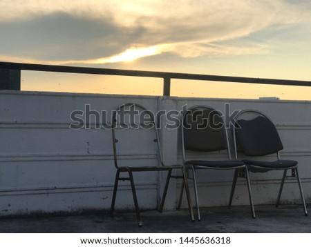 Old chair standing in sunset on tower