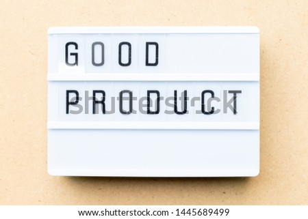 White lightbox with word good product on wood background