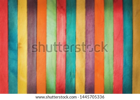 Colourful wooden wall texture in bright rainbow swatch pattern. Multicolor abstract background for banner design.
