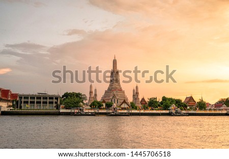 Beautiful temple Wat Arun Ratchawararam at sunset on the Chaophaya river in sunset time, Bangkok, Thailand