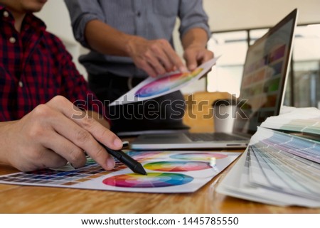Graphic designers choose colors from the color bands samples for design .Designer graphic creativity working concept . 