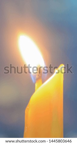 
Candle flame at night, orange light