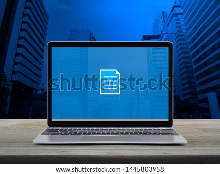 Document flat icon with modern laptop computer on wooden table over office city tower and skyscraper, Business communication online concept