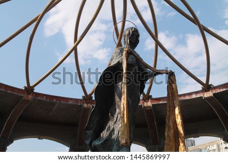 Complex " Pantheon of Memory" of Chornobyl. Sculpture of the mother of God trick with side. Honoring the participants of the liquidation of the consequences of the accident at the  Nuclear Power Plant Royalty-Free Stock Photo #1445869997