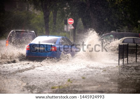 Strong rain in the city. Street of the city flooded after heavy rains