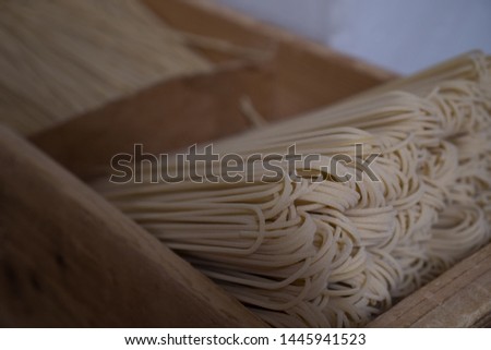 Homemade spaghetti from Lari in Tuscany, Italy. Bent end of pasta is the sign of a small scale factory.