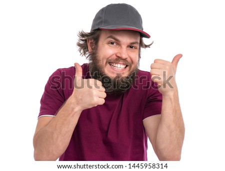 Portrait of crazy bearded Delivery man in cap. Funny man making thumbs up gesture. Courier isolated on white background.
