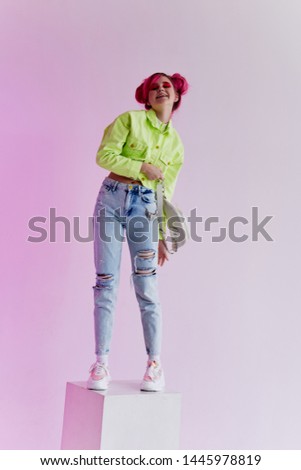 woman with pink hair stands on neon cube studio retro