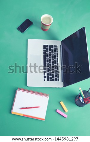 Laptop, phone with empty screen, gift box, coffee on rustic wooden table flat lay