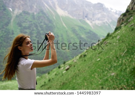 woman with camera nature tourism travel