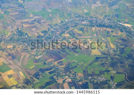 Aerial view of mountains, rivers, clouds, Agricultural Landscape areas the green and yellow rice field, Aerial view of grew in different pattern, And housing.Remote viewing.