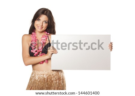 young smiling girl in a straw skirt and a flower necklace, holding a blank advertising banner