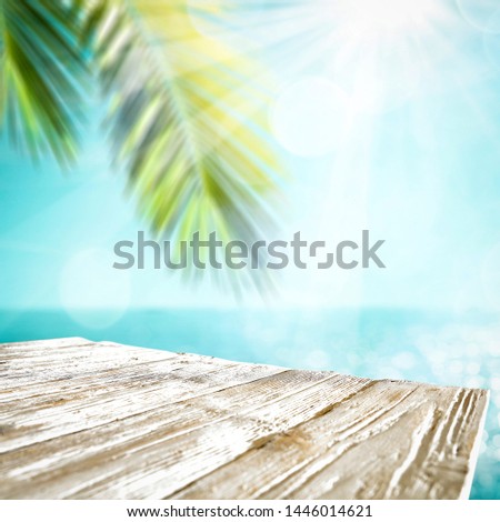 Wooden table of free space for your decoration and summer beach landscape 
