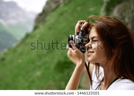 woman with camera snapshots nature mountains summer