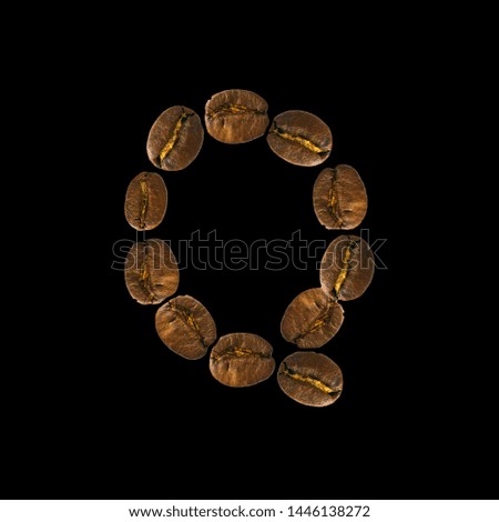 Coffee font alphabet concept isolated on white background. Top view Alphabet made of roasted coffee beans. Letter Q