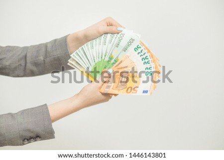Female hands holding euro banknotes on a white background. Euro Money. euro cash background