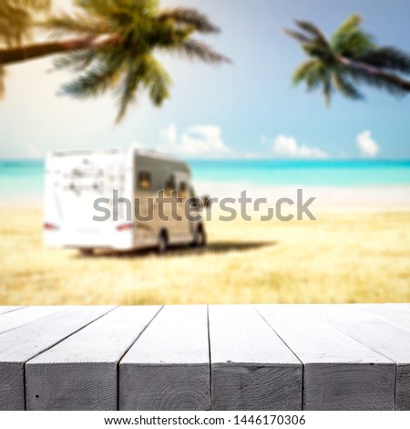 Summer background of beach and free space for your decoration. Wooden old table background and summer time. 