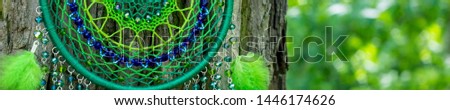 Banner of Dream catcher with feathers threads and beads rope hanging. Dreamcatcher handmade