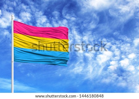 National flag Pansexuality Pride on a flagpole in front of blue sky