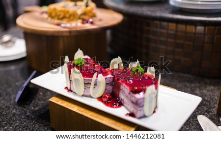 Picture of Blueberry layer cake with blueberry jam topping, served on restaurant