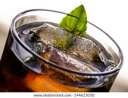 Rum and diet coke with mint black mojito close up