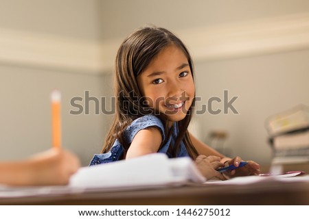 Little Girls Working On School Work Royalty-Free Stock Photo #1446275012