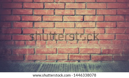Bricks. Industrial background, empty urban street with brick wall. Loft.  Red messy grunge style brick wall surface. Vintage wall background with vignetted edges. Brown, orange, red, grey colors. 
