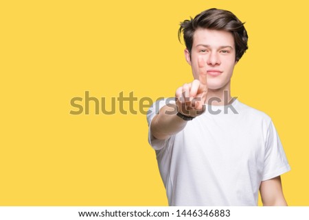 Young handsome man wearing casual white t-shirt over isolated background Pointing with finger up and angry expression