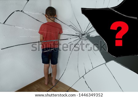 a punished boy, a junior schoolboy, is reflected in the shards of a broken mirror, is standing in the corner, turned to the wall, a question mark