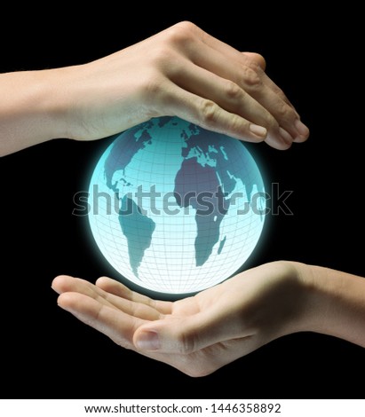 A Earth model between two palms of a woman on black isolated background. Save the planet concept.