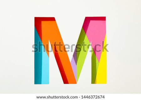 Multicolor letter M on white background, space for text