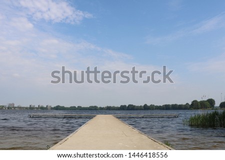 Scaffolding or dock above water body Royalty-Free Stock Photo #1446418556