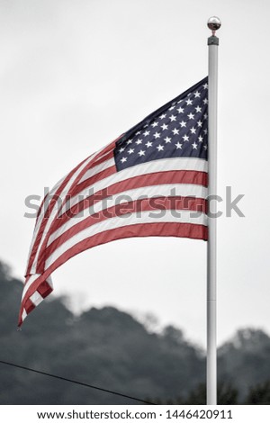 the American flag waving in the wind