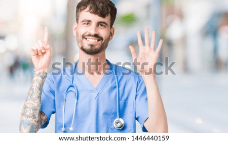 Young handsome nurse man wearing surgeon uniform over isolated background showing and pointing up with fingers number six while smiling confident and happy.