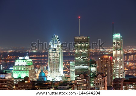 Montreal at dusk with urban skyscrapers viewed from Mont Royal