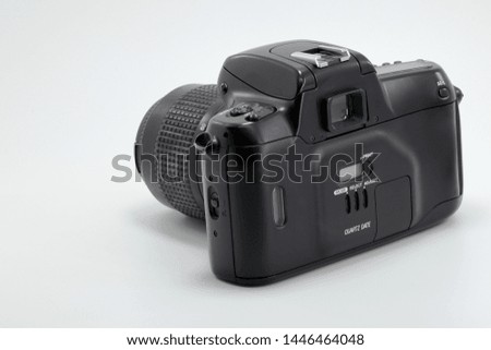 Old SLR film camera back side isolate on white background.