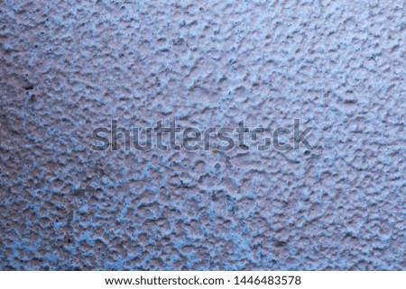 Texture of purple, lavender paint. Old surface with crack pattern.