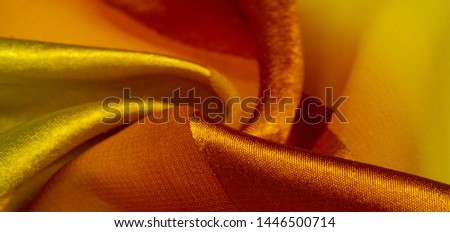 Texture, background, yellow silk striped fabric with a metallic sheen. If you have a bad mood, this fabric will lift it to unprecedented heights. Your project will be successful. Royalty-Free Stock Photo #1446500714