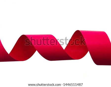 Red ribbon roll isolated on white background