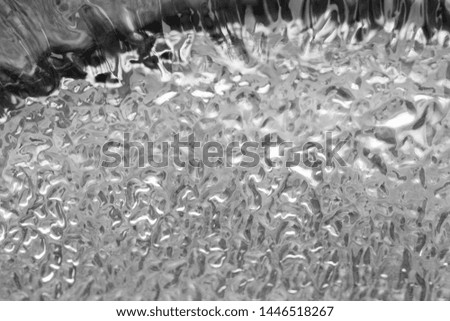 Abstract background of drying linseed oil, showing the thick texture of the liquid