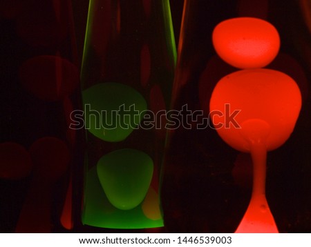 Colourful lava lamps next to and behind each other